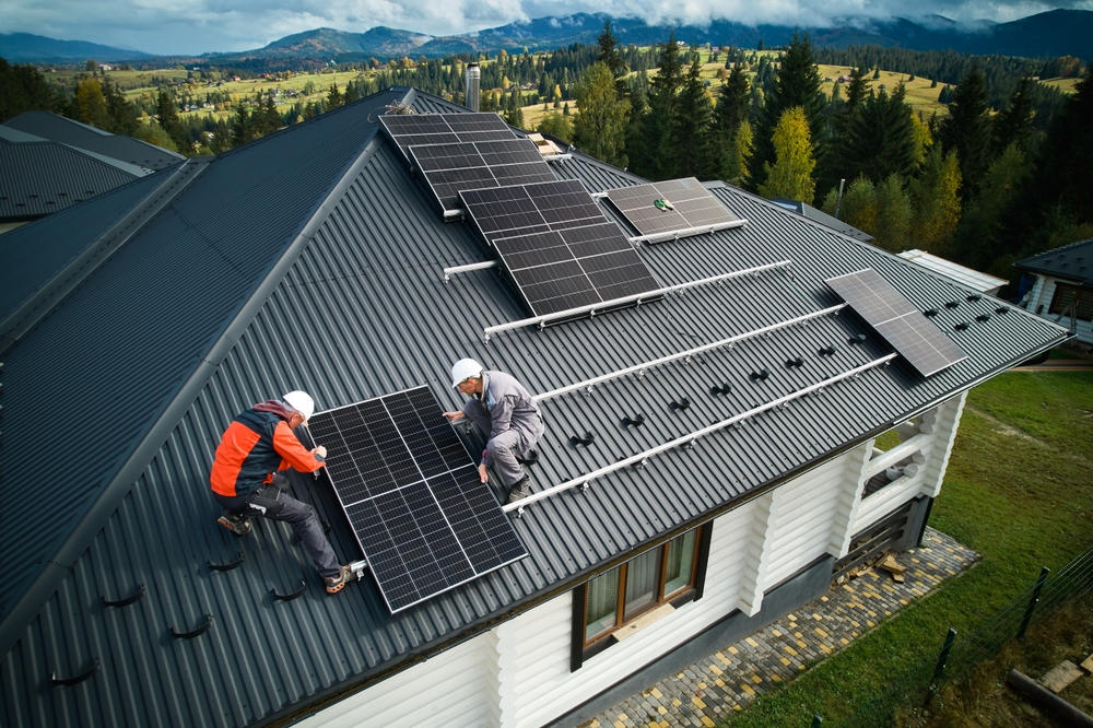 Technicians,Building,Photovoltaic,Solar,Module,Station,On,Roof,Of,House.