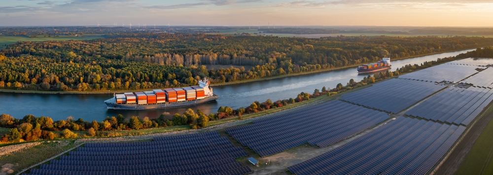 Panorama,View,Of,Two,Large,Container,Ships,Sailing,Along,Canal,